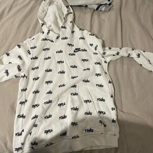 1 Nike sweater and a Buc-ee’s long sleeve top